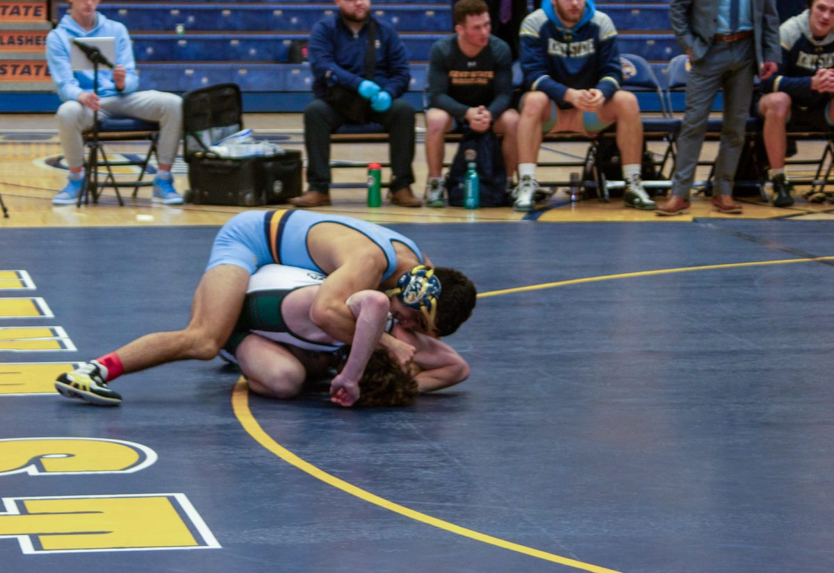 Kent State freshman Adan Benavidez pins Ohio University freshman Bryce Skinner during the meet on Feb. 10, 2024. 