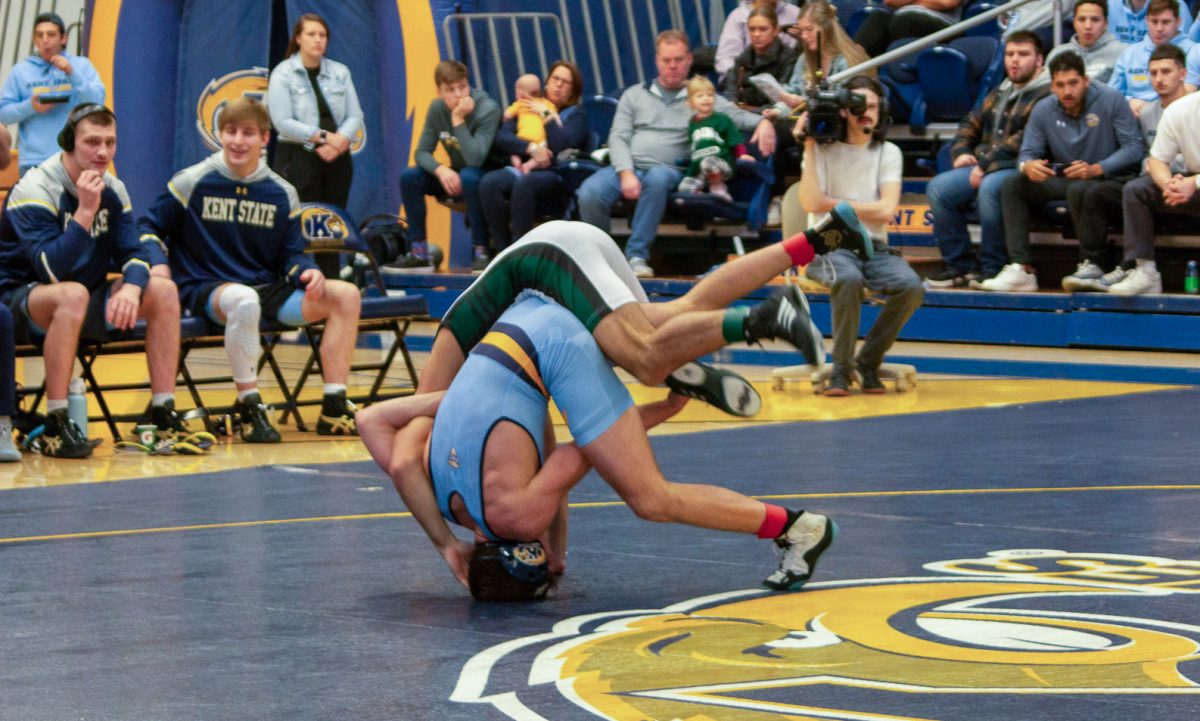 Kent sophomore Pablo Castro flips Ohio University sophomore Malachi O'Leary during the meet on Feb. 10, 2024. 