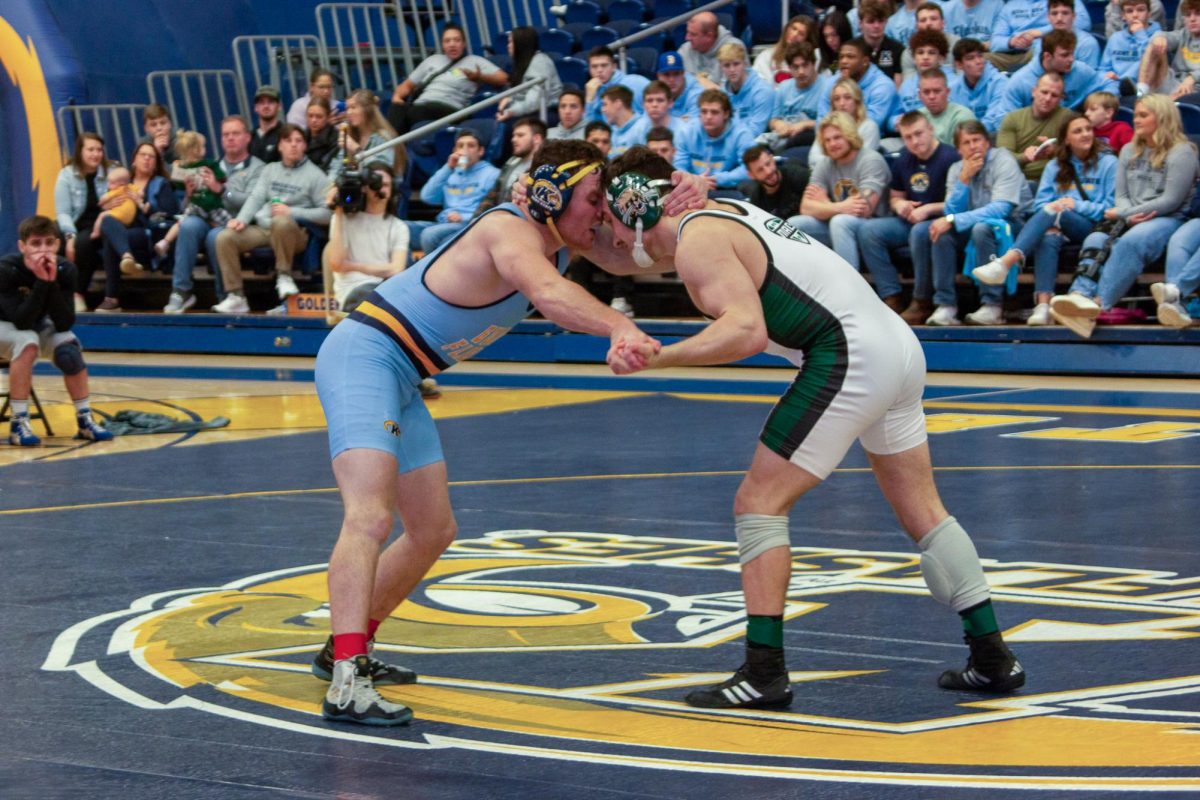 Kent sophomore Billy Meiszner grapples with Ohio University junior Aidan Waszak on Feb. 10, 2024.