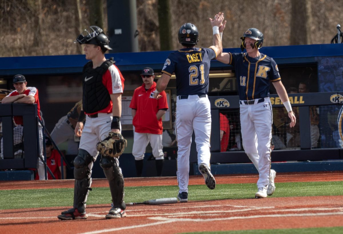 Junior Left Fielder Jake Casey and Kolton Schaller high five right after both score on a Reese double during the Golden Flashes' 27-0 blowout of Youngstown State on March 12, 2024.