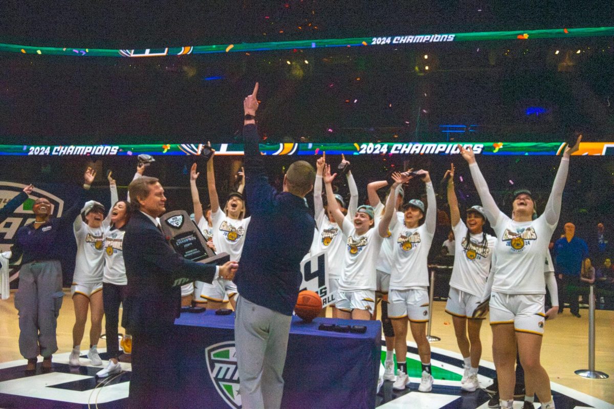 The Kent State women's basketball team celebrates winning the MAC Women's Basketball tournament on Saturday, March 16, 2024. 