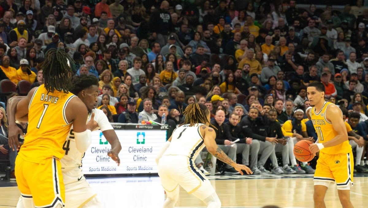 Kent State redshirt senior Giovanni Santiago reads the play as redshirt junior VonCameron Davis tries to break away from Akron senior Ali Ali in the MAC Men's Basketball championship tournament game on Saturday, March 16, 2024. 