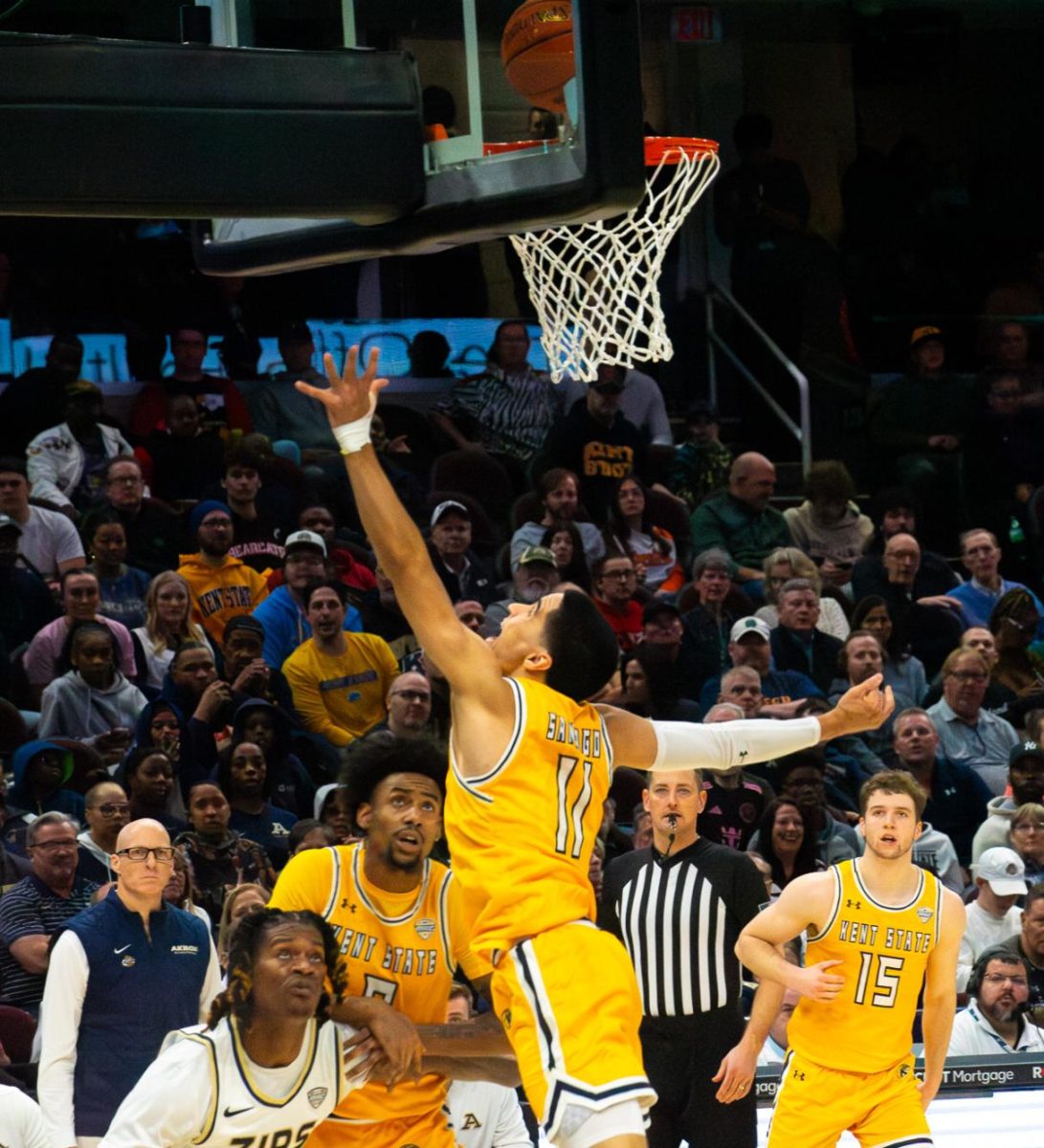 Kent State redshirt senior Giovanni Santiago makes a layup in the championship game against Akron at the MAC Men's Basketball tournament on Saturday, March 16, 2024. 