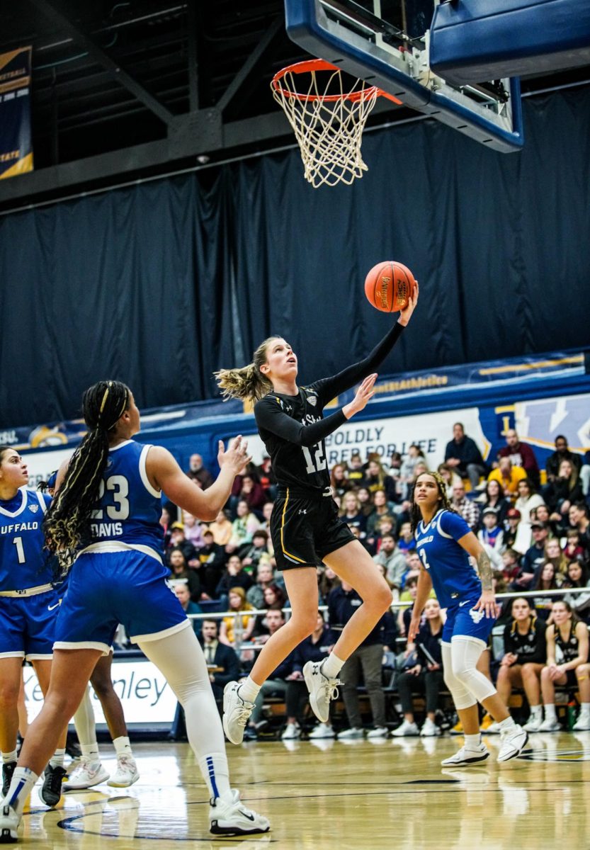 Jenna Batsch finishes at the rim against Buffalo University on March 2, 2024.