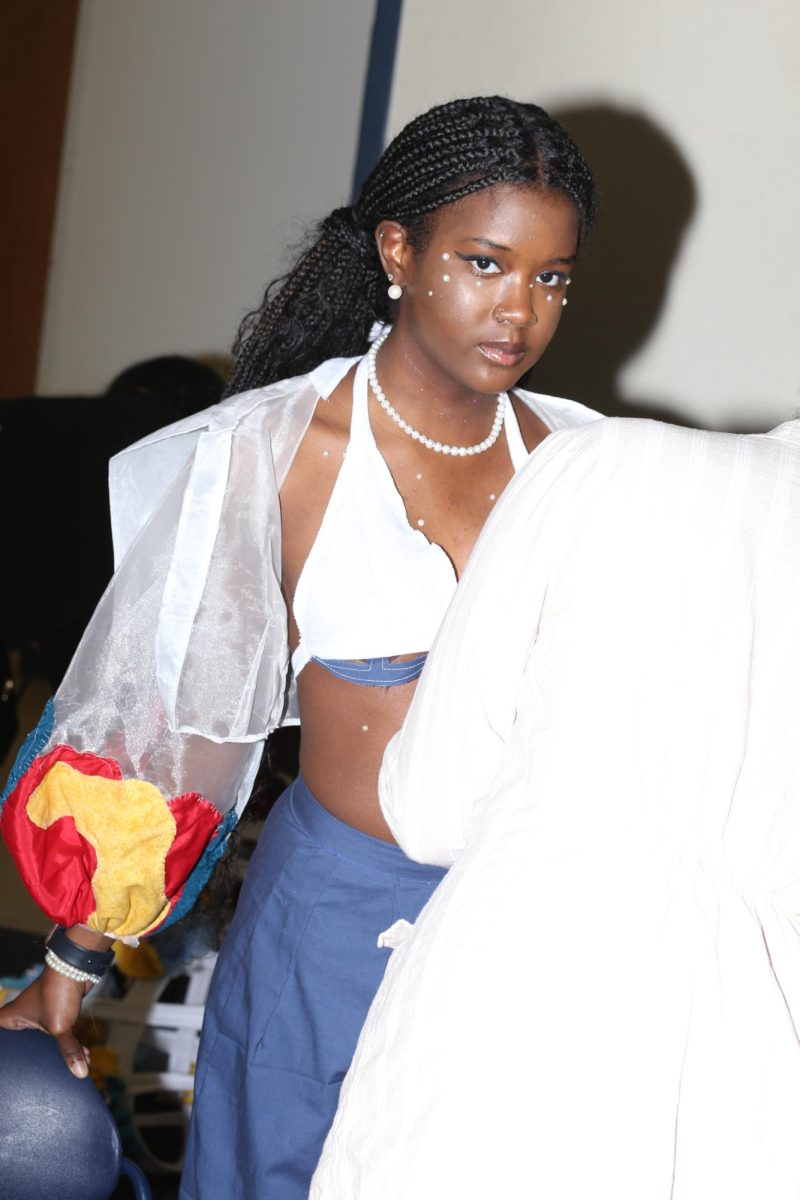 A model prepares to walk in the Fabric Pantry fashion show on March 9, 2024.