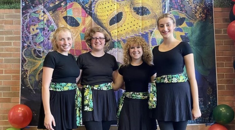 Members of the university's Irish Dance Club, including co-president Addison Foreman (center right), pose after a performance in 2023. 