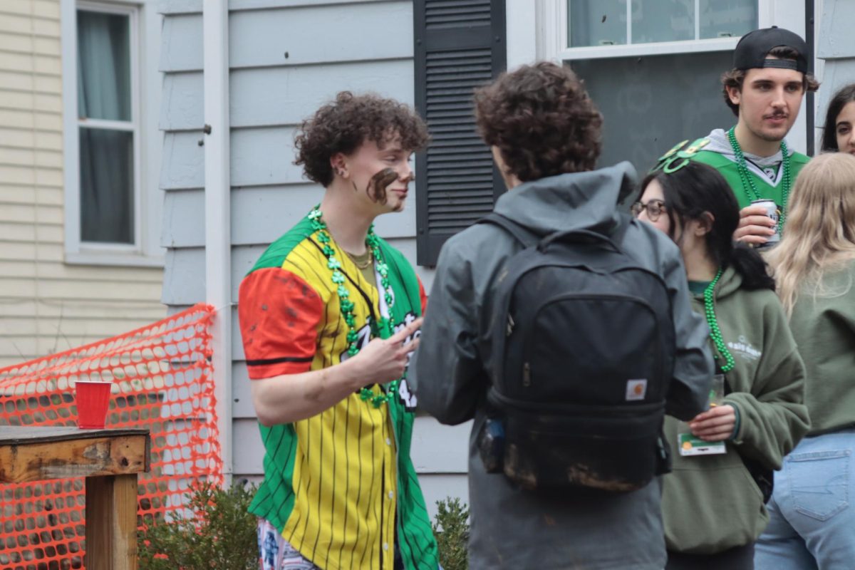 Students at a local frat rub mud on their face while celebrating Fake Paddy's Day on March 9, 2024