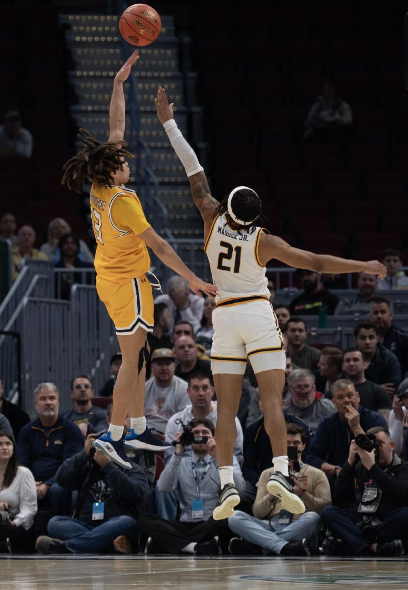 Junior guard Jalen Sullinger shoots a sky hook over Toledo's Dante Maddox Jr. in the Mid-American Conference Tournament matchup on March 14, 2024.