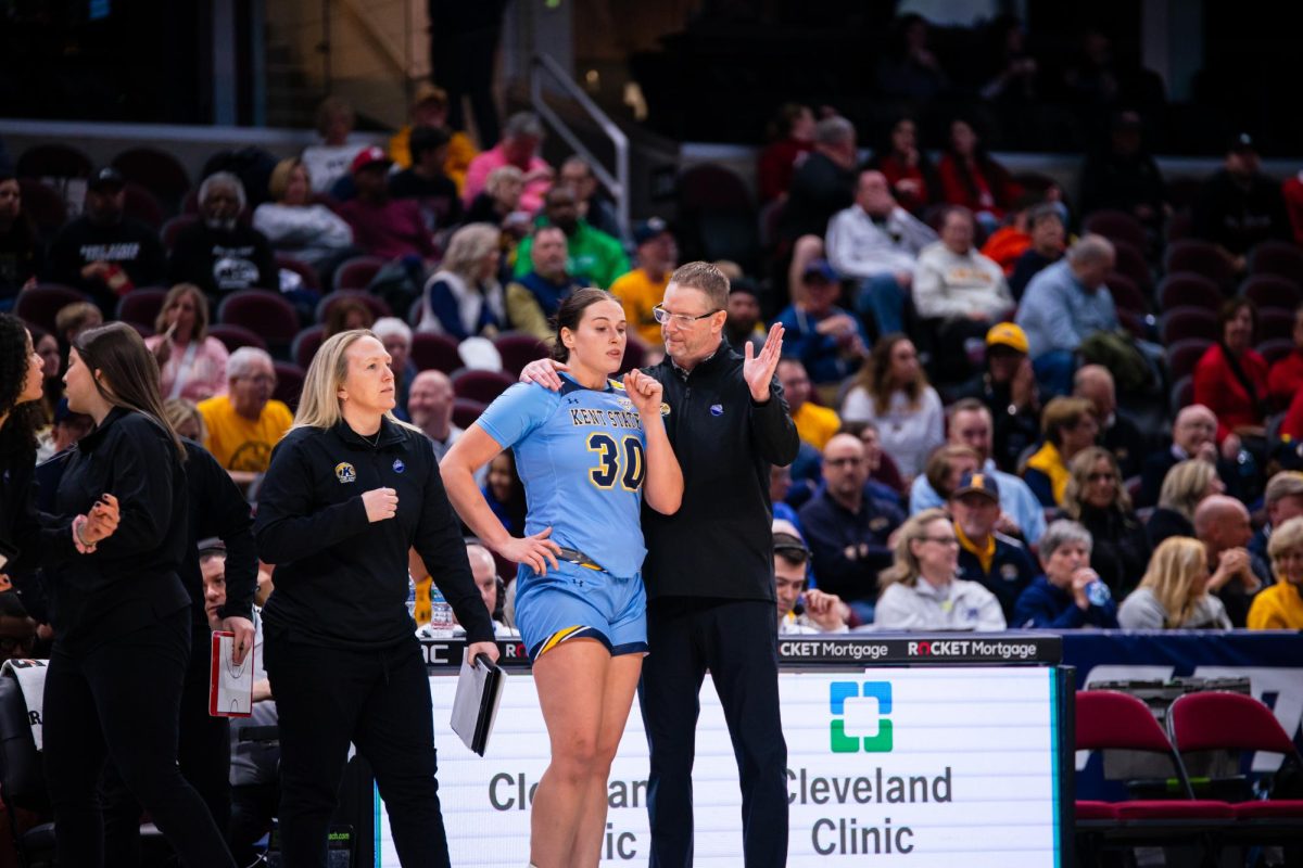 Head Coach Todd Starkey discusses with Graduate Mikala Morris during the Mid-American Conference Tournament on March 15, 2024.