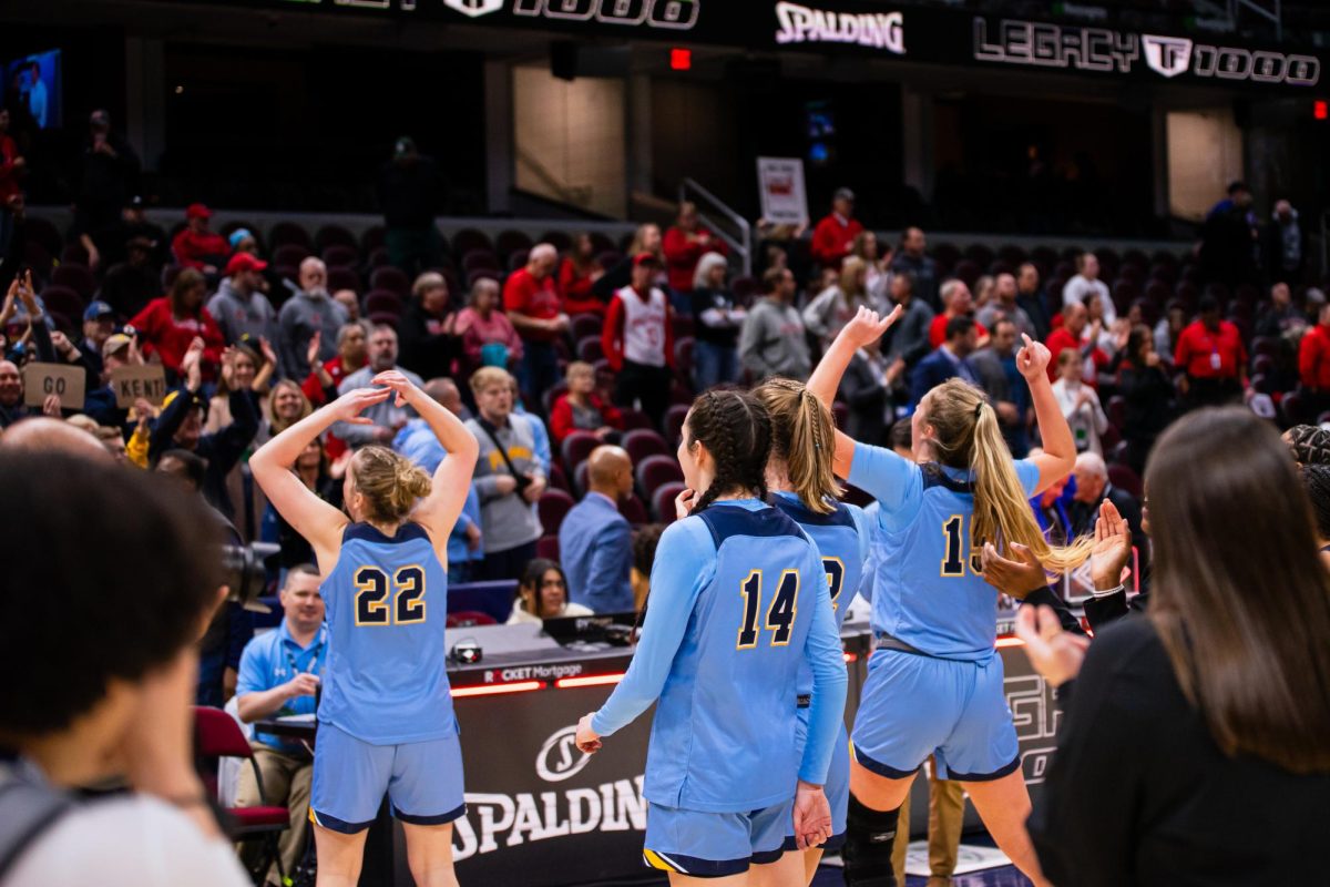 Kent State Women's Basketball team celebrates with the crowd after winning against Ball State on March 15, 2024