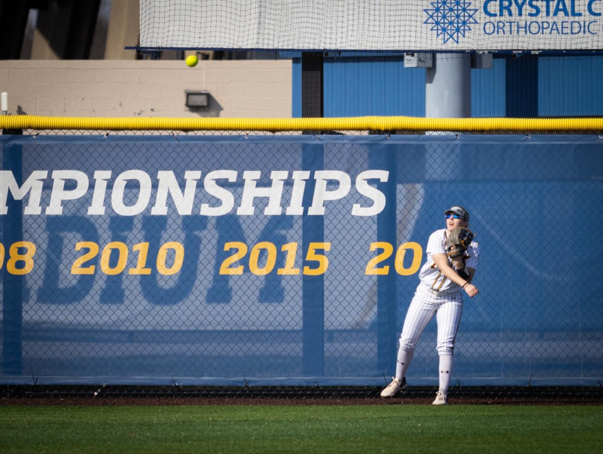 Freshman outfielder Kenzie Bromley throws a ball after catching it in the game against Youngstown on March 13, 2024.