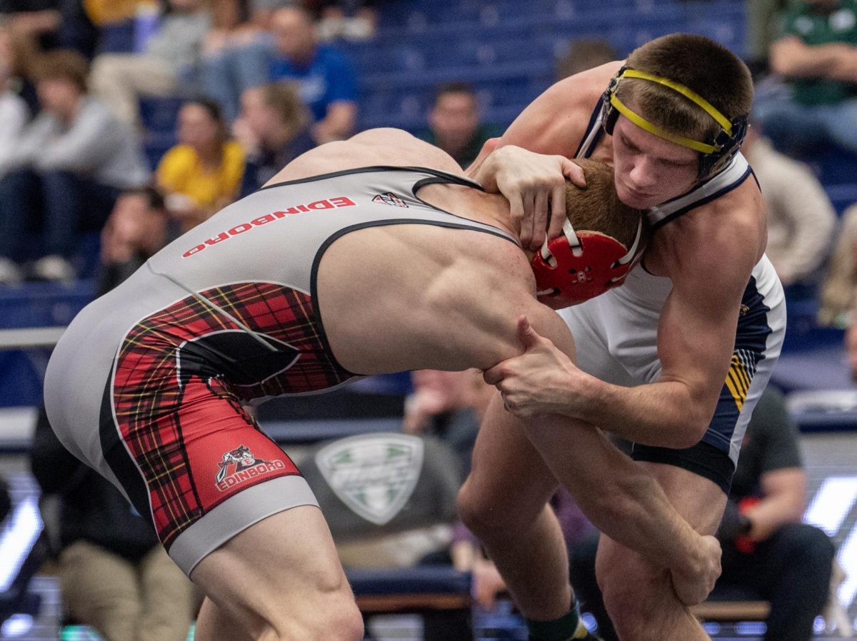 Edinboro's Jack Kilner tries to pull out Blake Schaeffer's leg for a takedown during their Mid-American Conference quarterfinal match on March 8, 2024.