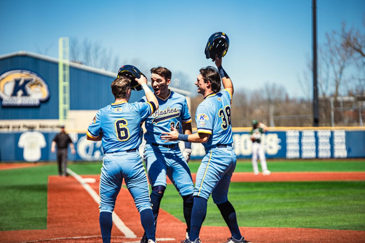 Freshman Dom Kibler (left), Junior Hunter Klotz (middle) and Michael McNamara (right) celebrate after Klotz hit a home run on April 7, 2024.