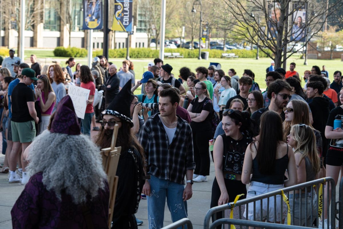 Protesters gather along the barricades set up in front of The Student Center arch to speak out against Kyle Rittenhouse's speech April 16, 2024. 