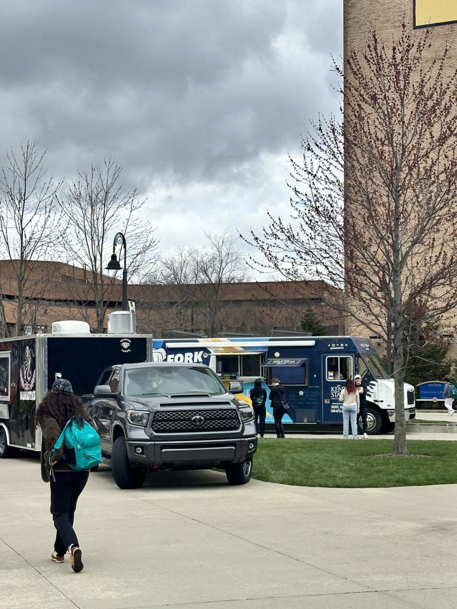 Food trucks sit outside on Risman Plaza.