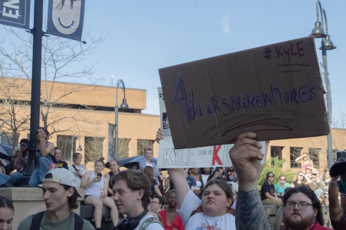 A sign holding Kyle Rittenhouse's old 2020 TikTok account in the crowd April 16, 2024.