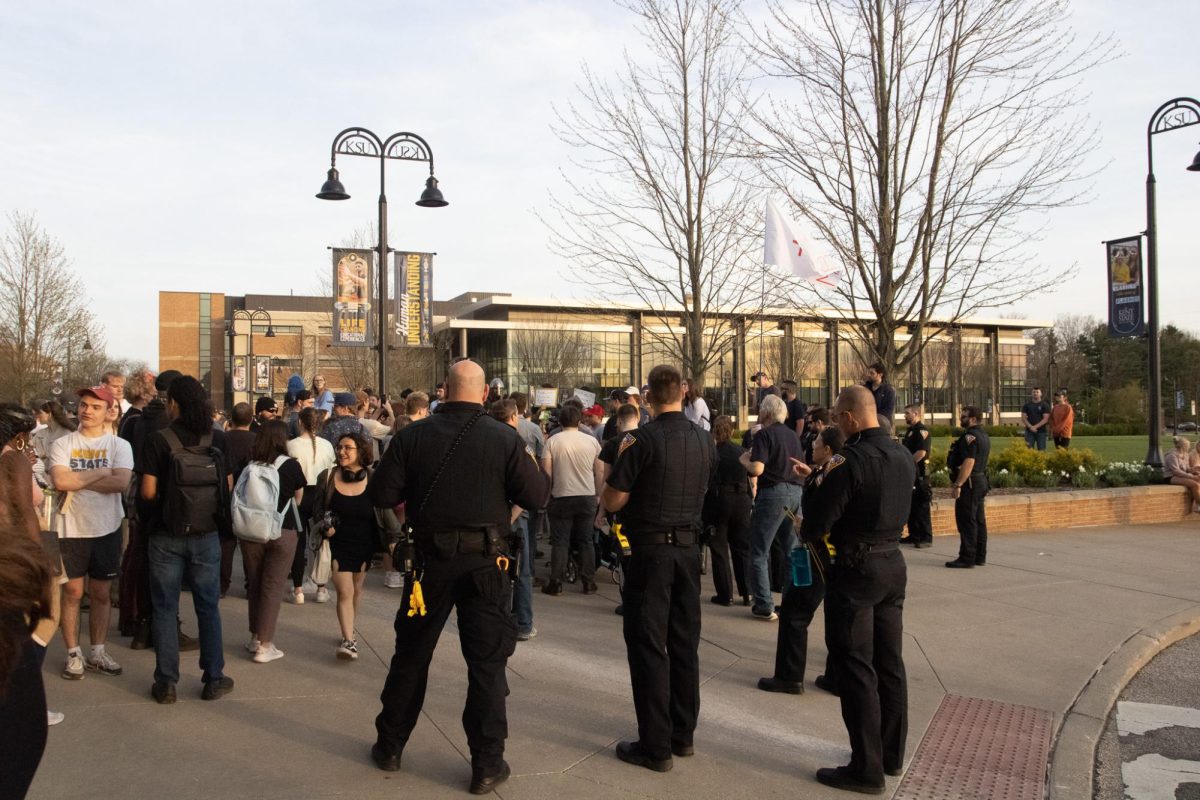 Kent police survey the crowd on April 16, 2024 after the protest against Kyle Rittenhouse's presence on Kent State's campus comes to an end.