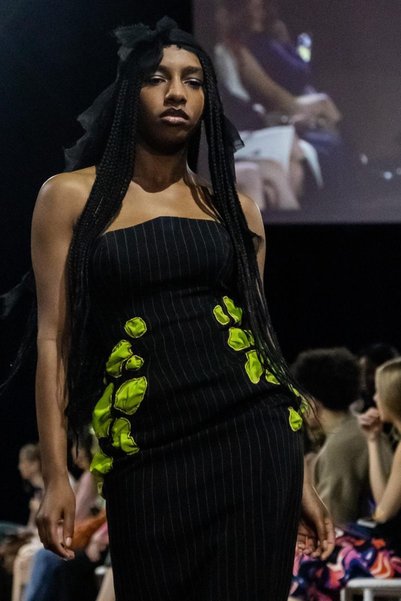 A model poses at the end of the catwalk in the Kent State Ballroom on April 25, 2024.