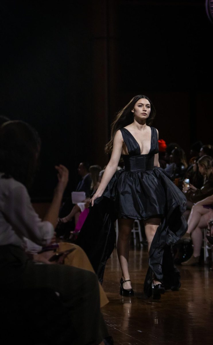 Model wearing a garment designed by Isabella Lasky walks down the runway during the KSU Annual Fashion Show on April 25, 2024.