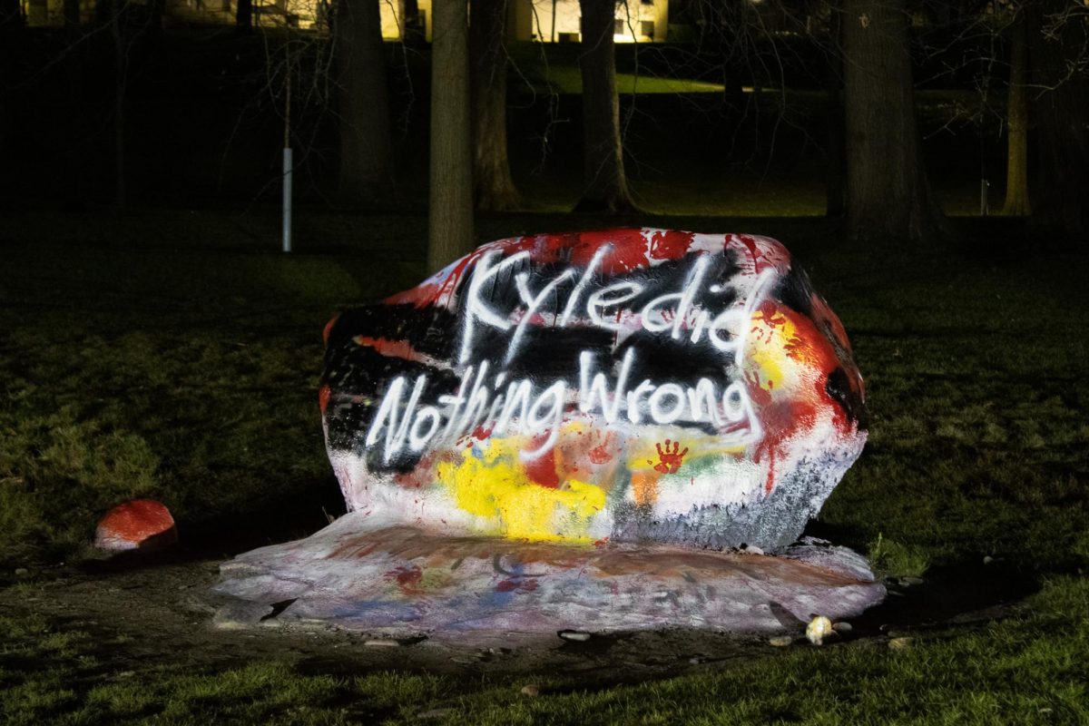 The message 'Kyle did Nothing Wrong' is left behind on the Rock after the student led protests earlier in the day April 15, 2024, against Kyle Rittenhouse's presence on campus.