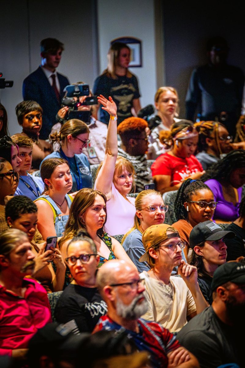 A person in the crowd raises their as the Q&A session with Kyle Rittenhouse begins April 16, 2024.