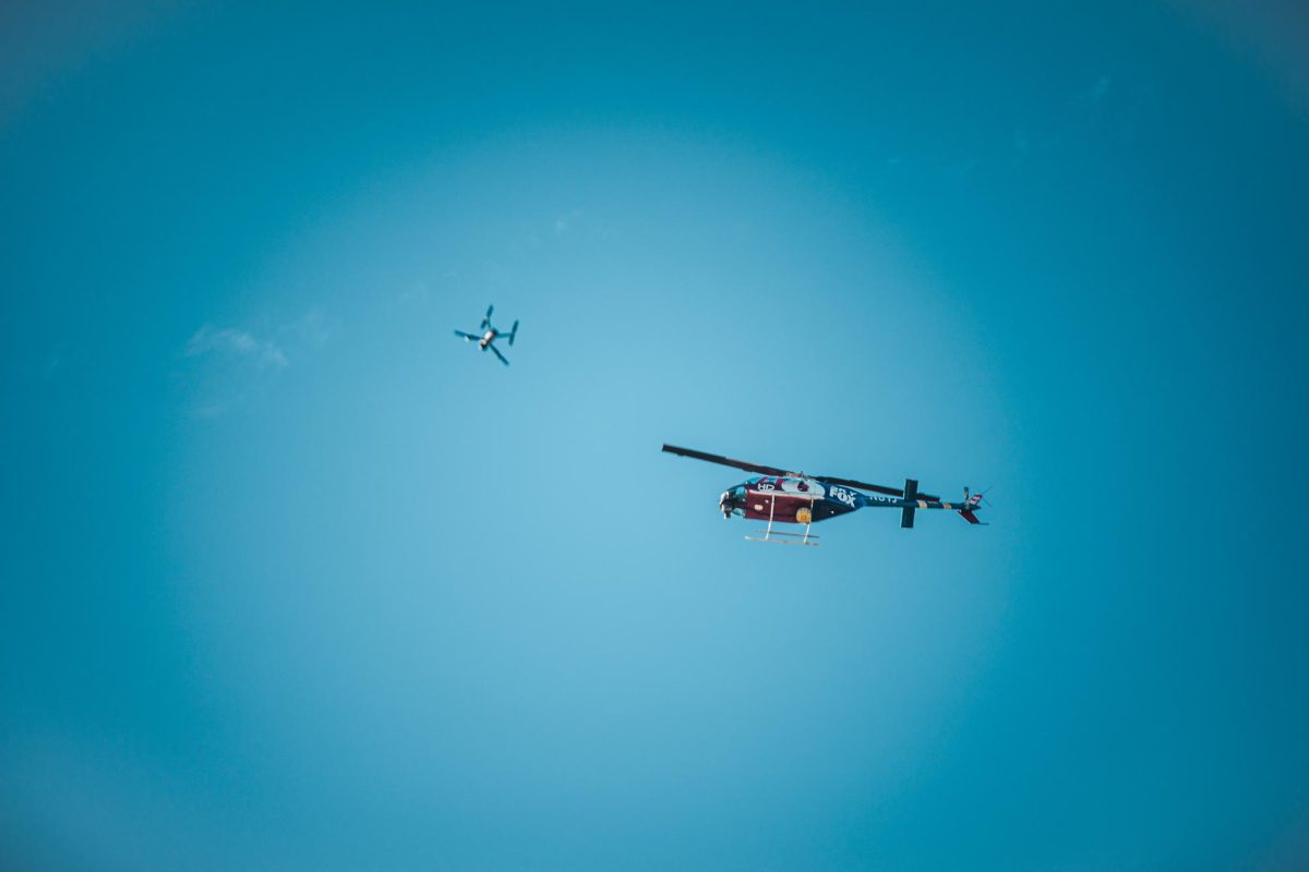 Fox News helicopter and drone flies overhead of the student center at Kent State on April 16, 2024.