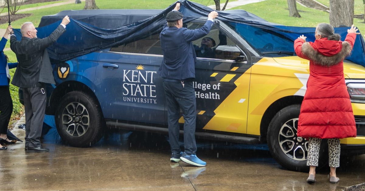 From left, Joseph Diorio, Portage County Health District Commissioner, Dr. Todd Diacon, Kent State University President, and Mary Smith, Elizabeth Severance Prentiss Foundation Trustee, unveil the new Mobile Flashes Unit on April 4, 2024.