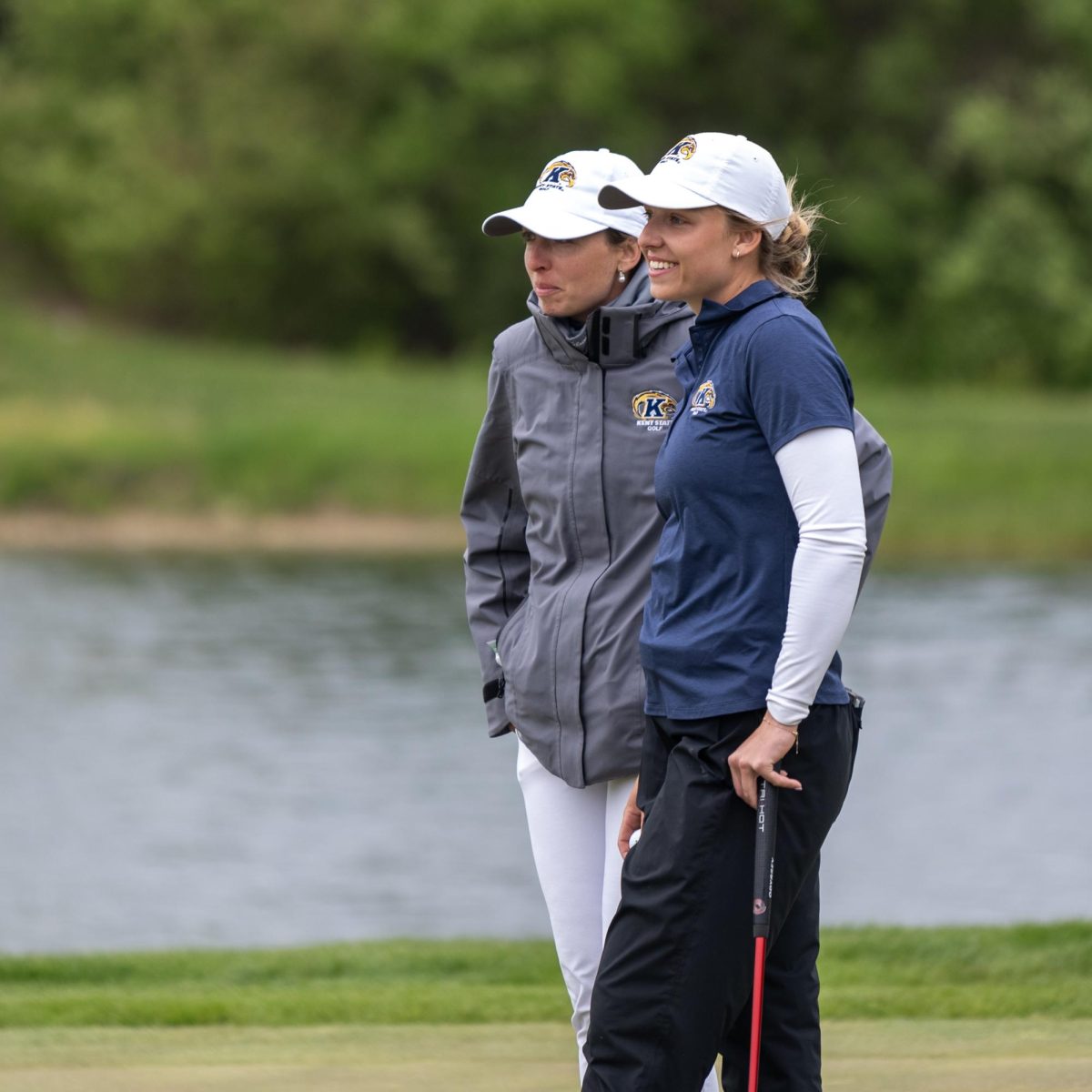 Senior Hester Sicking and Assistant Coach Manuela Carbajo Ré share a moment while waiting for Sicking's putt during the final round of the Mid-American Conference Championships in Grove City, OH, on April 24, 2024.