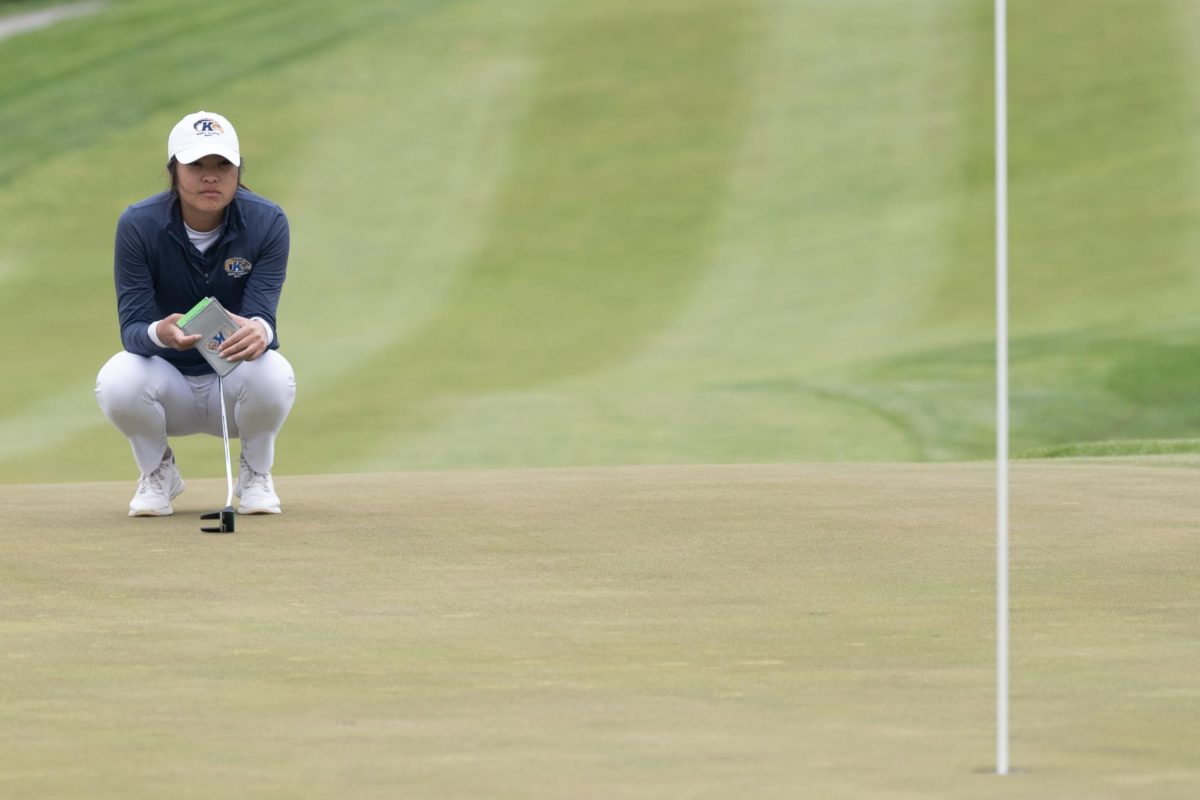 Junior Jennifer Gu examines the putting line during the final round of the Mid-American Conference Championships in Grove City, OH, on April 24, 2024.