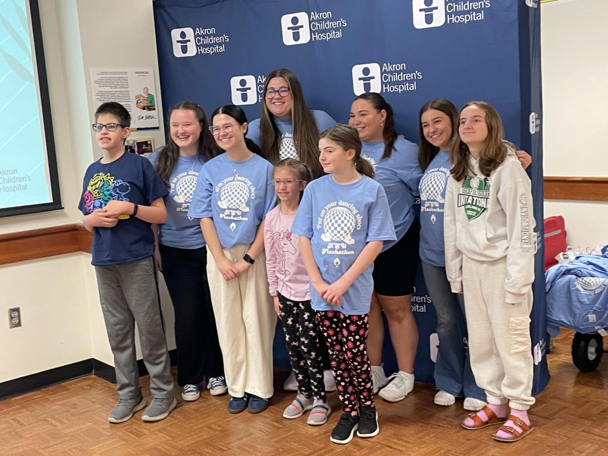 Students and children pose at Flashathon.