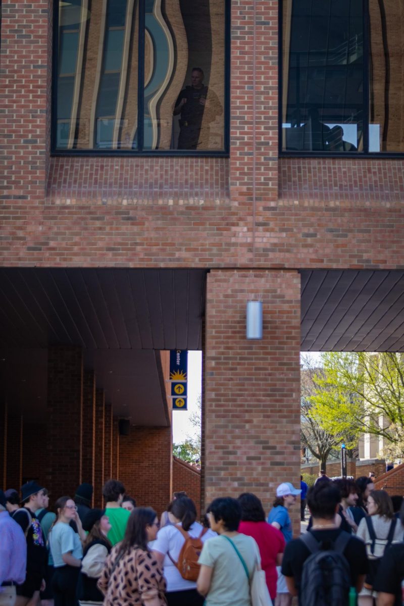 A police officer looks out at the crowd at the Rittenhouse event on April 16, 2024.