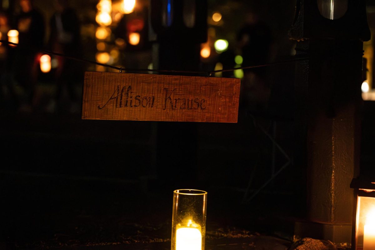 Candles and signs bearing the names of the students who lost their lives on May 4th mark there memorials for attendees of the Candlelight Walk and Vigil May 3, 2024. 