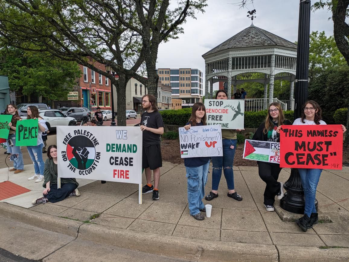 Activists hold up signs calling for a ceasefire in Gaza on May 4, 2024.