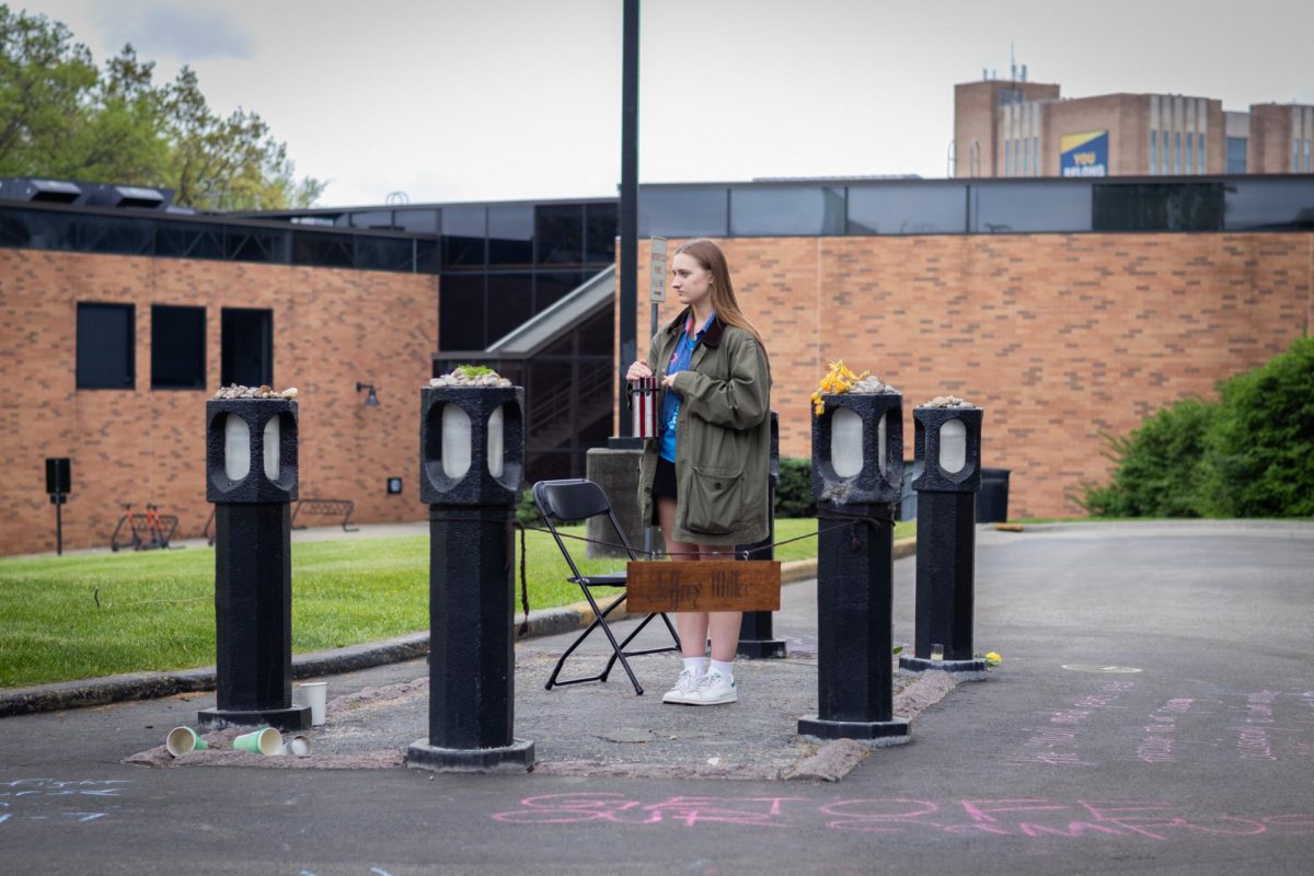 A participant of the candlelight vigil carries on part of 24 hour silent vigil on May 4, 2024. The vigil was organized by the May 4th Task Force. 