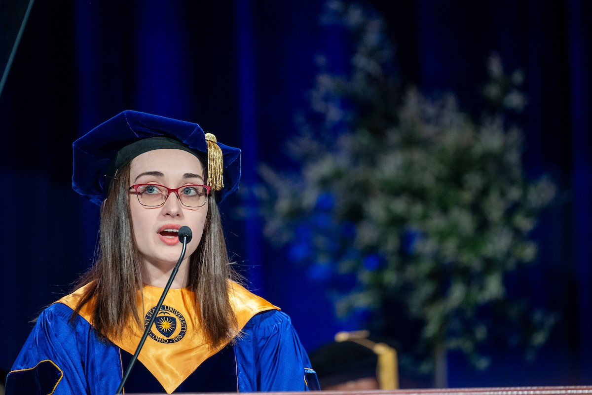 Haley Dees speaking at a 2024 spring commencement ceremony.