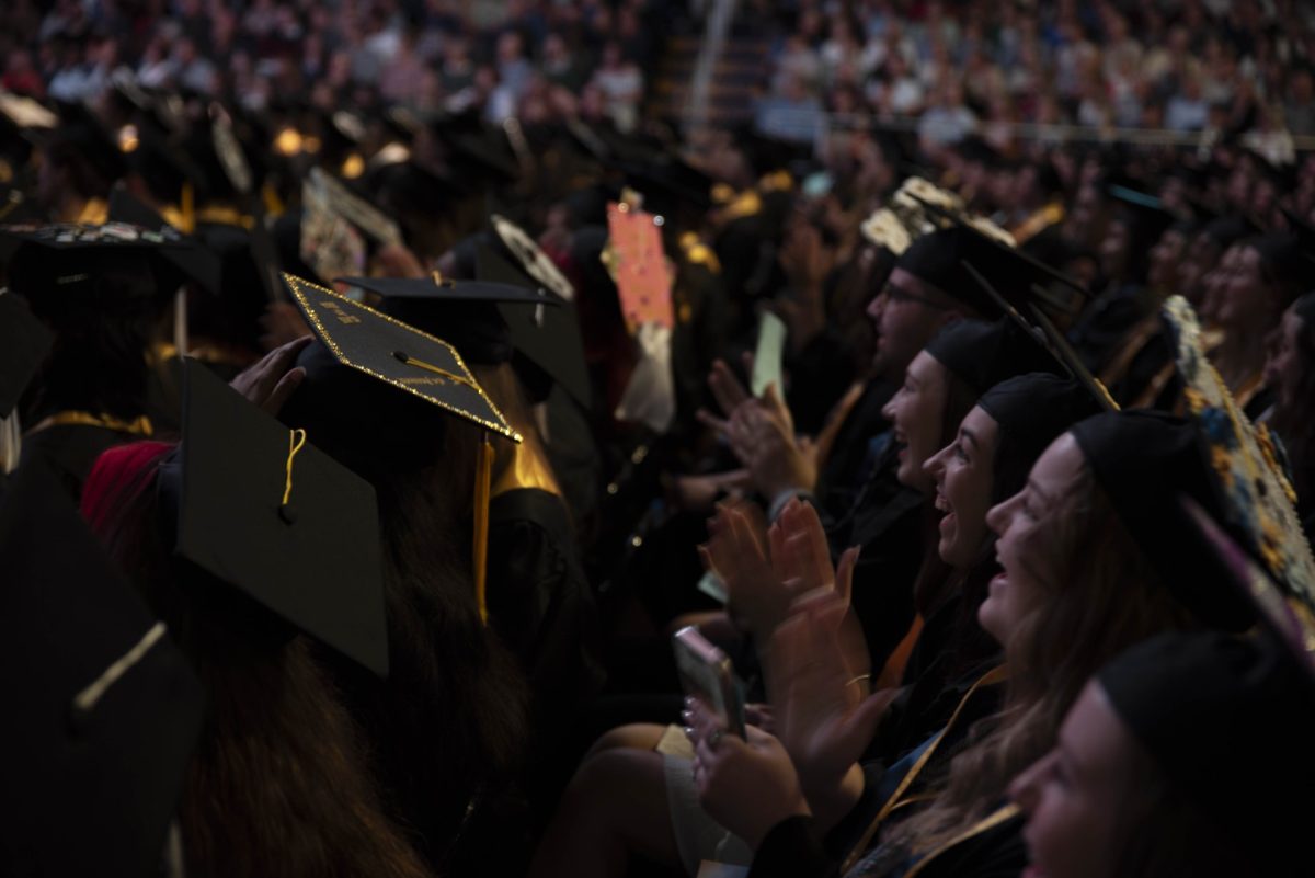 Graduates cheer at commencement for the College of Arts and Sciences and the College of Communication and Information on May 10, 2024, in the Memorial Athletic and Convocation Center.