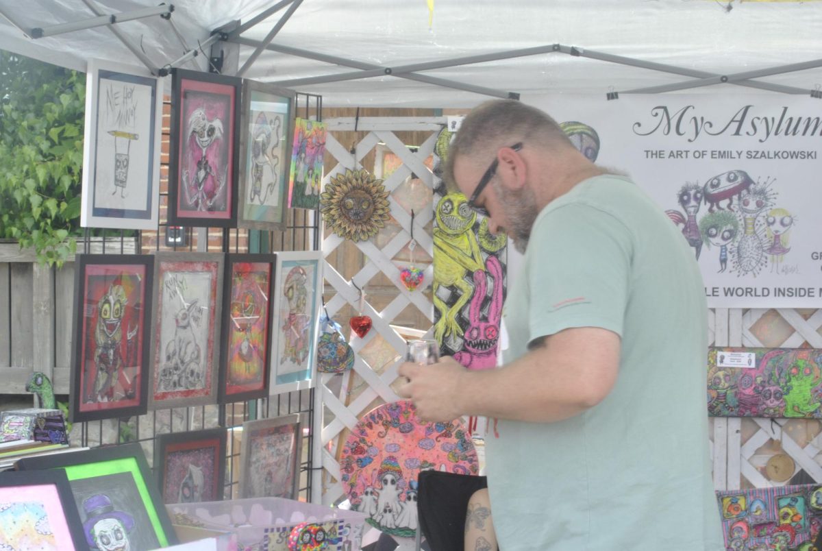 the Art and Wine Festival has been going on for 16 years. This is Art's first time at the festival as his wife has a booth, Dianna's Artwork. 