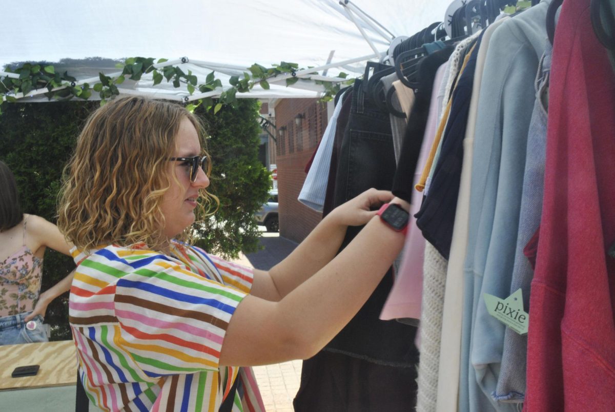 Tash Hartmann shops around at the many booths at the festival. 