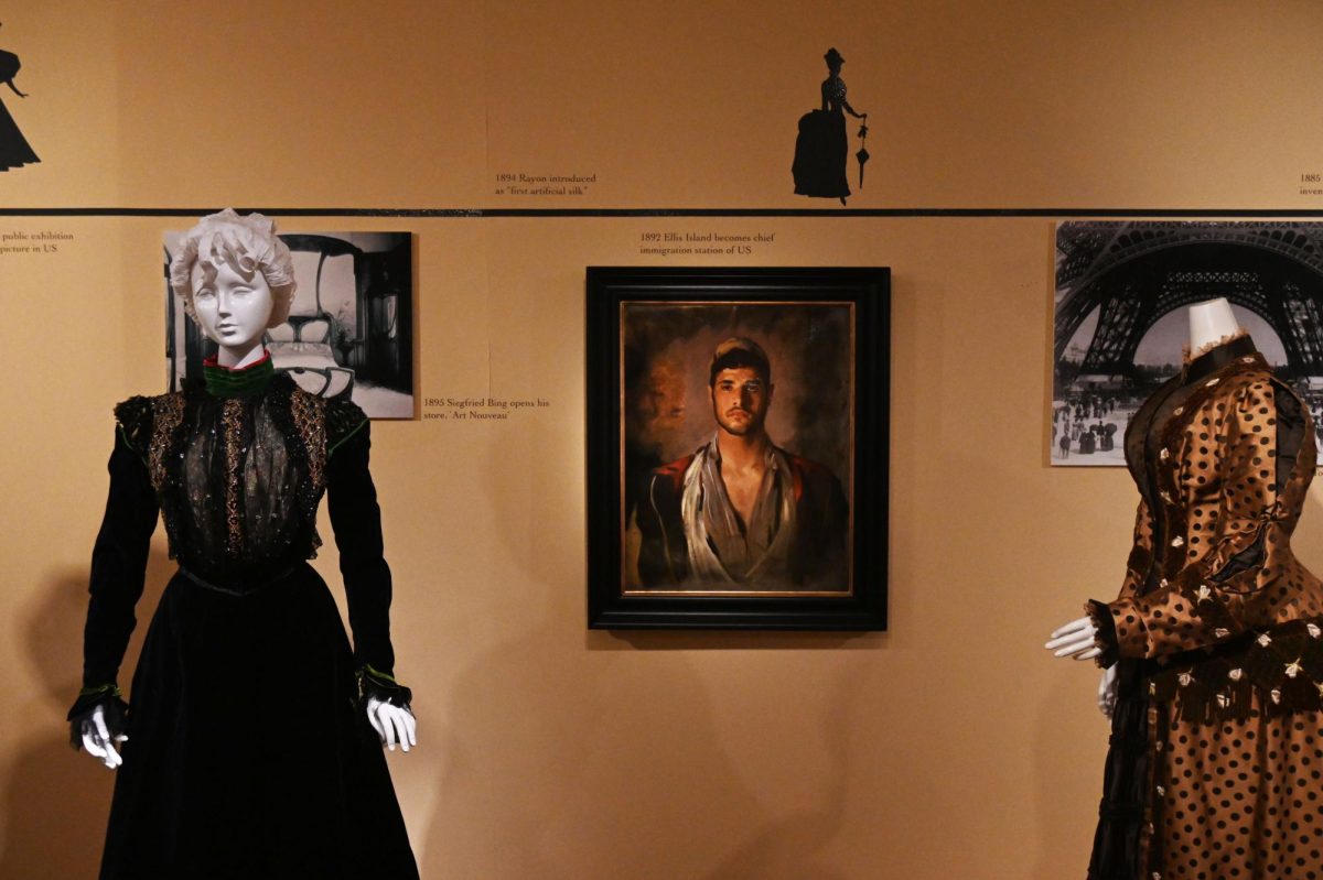 The fashline timeline exhibit showcases Kent State's collection of historical fashions. 