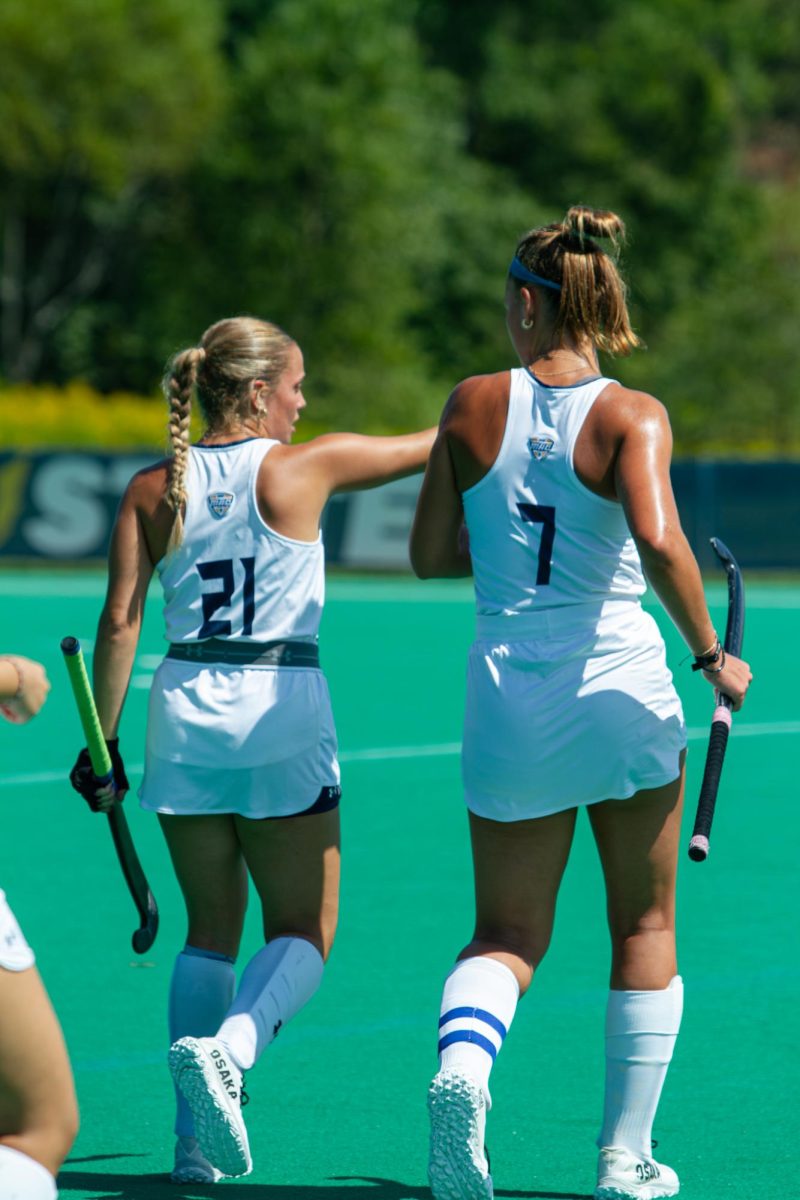 Bella Carpenter (left), Kent State Senior and Field Hockey Midfielder, and Emma Rolston (right), Kent State Junior and Field Hockey Forward, prepare to start the second quarter against the Liberty Flames, Sept. 1, 2024.