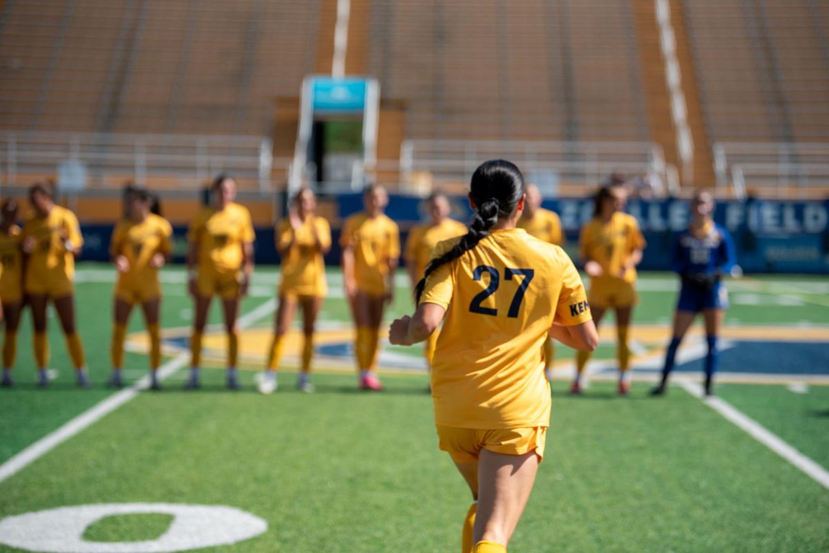 Katie Henahan, Kent freshman and midfielder, runs to join her team as they prepare for the game against Ball State, Sept. 22, 2024.