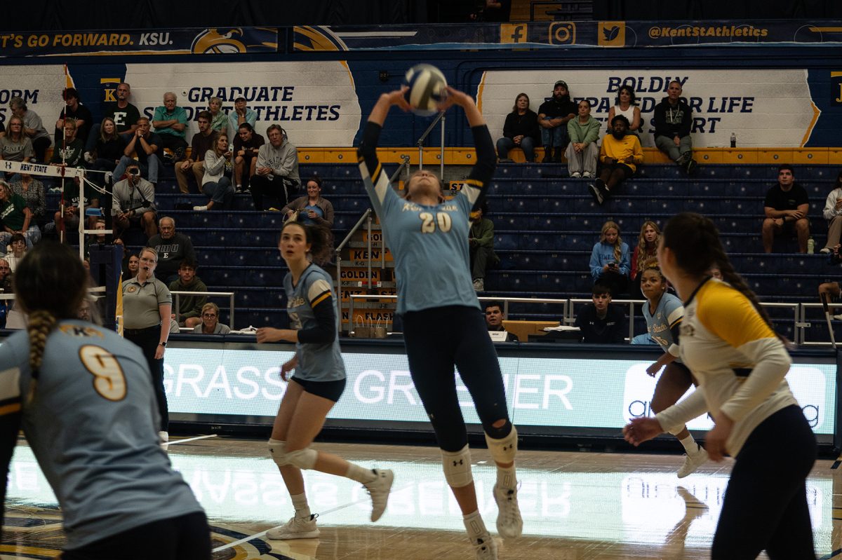 Junior Kendall White sets the ball at the game against Eastern Michigan on Friday. 