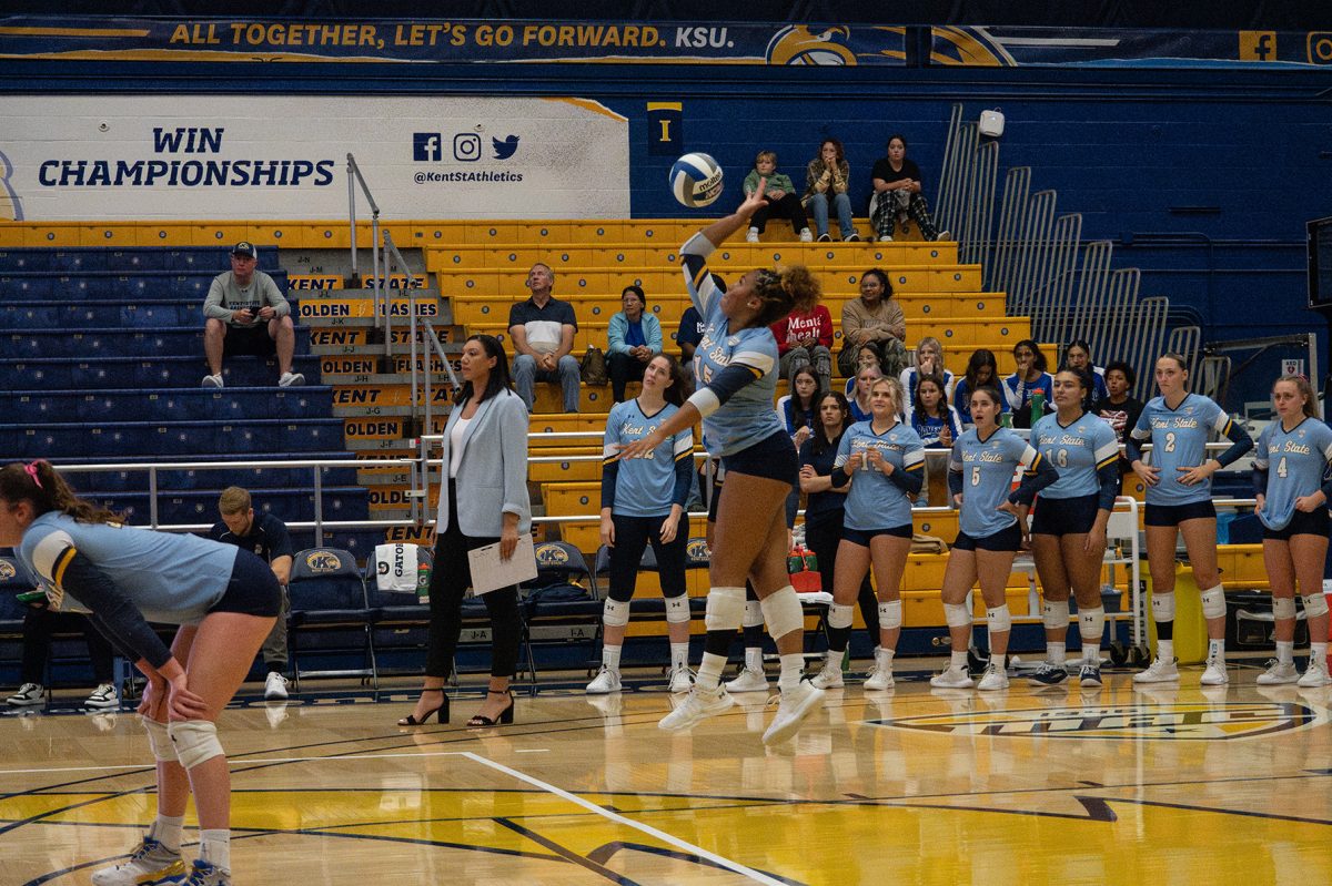 Sophomore Logan Henderson serves the ball at the game on Friday at the MAC against Eastern Michigan. 