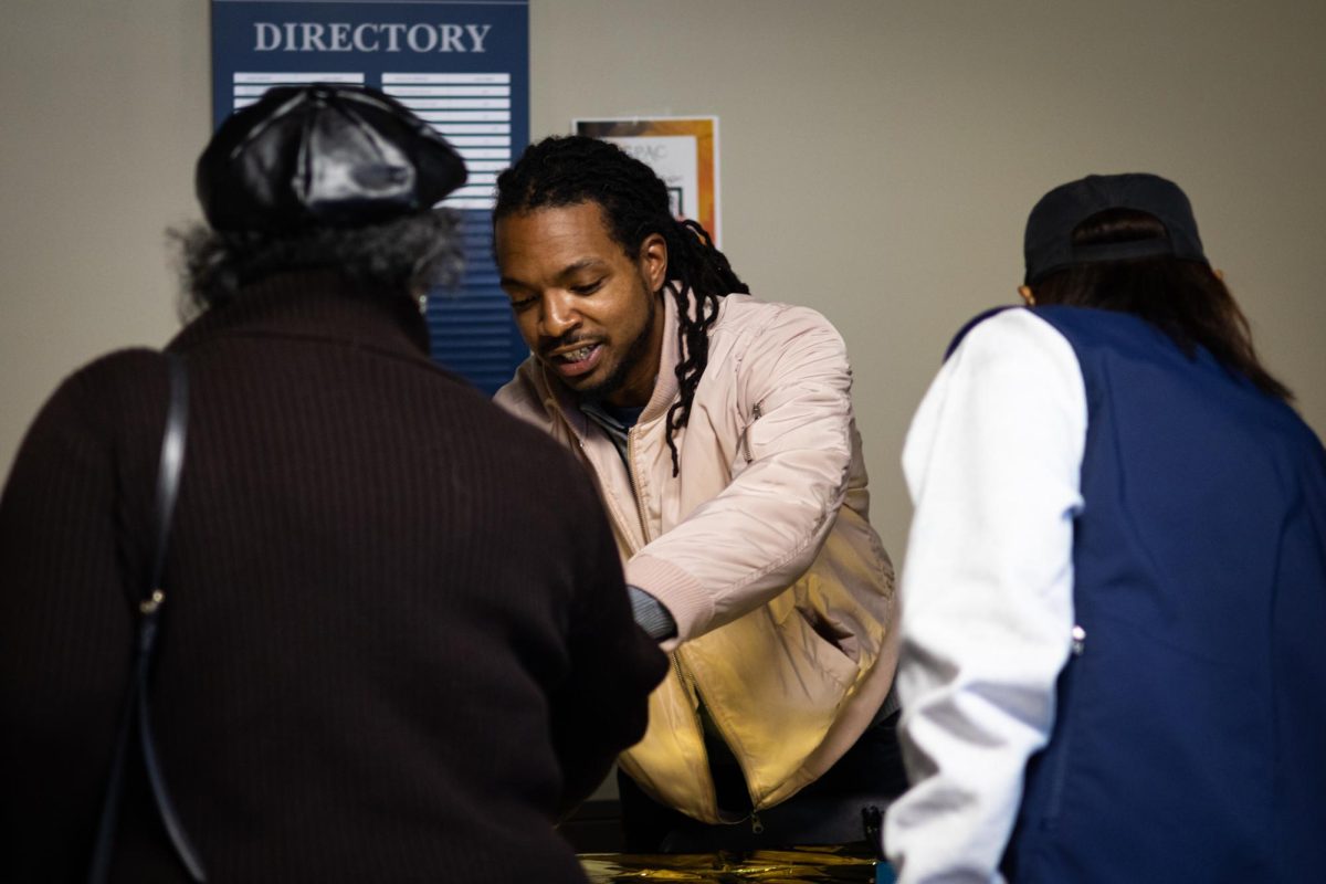 Volunteer and Kent State graduate Robert Whipple greets people as they come to the Black Alumni Chapter Homecoming Marketplace and Dance on Sept. 27, 2024.