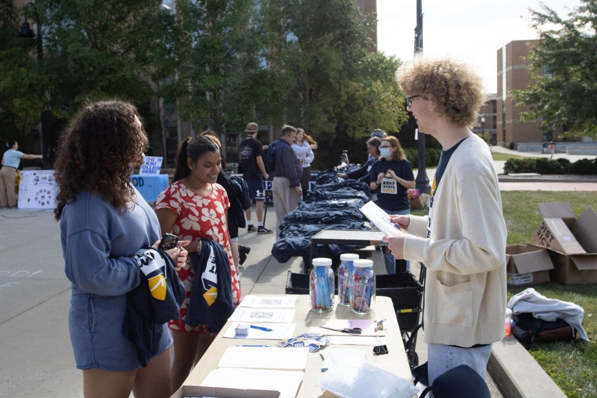 Director of Governmental Affairs Zach Graves helps students register to vote at the Flashes Vote Festival hosted by Kent State USG on Sept. 17, 2024. 