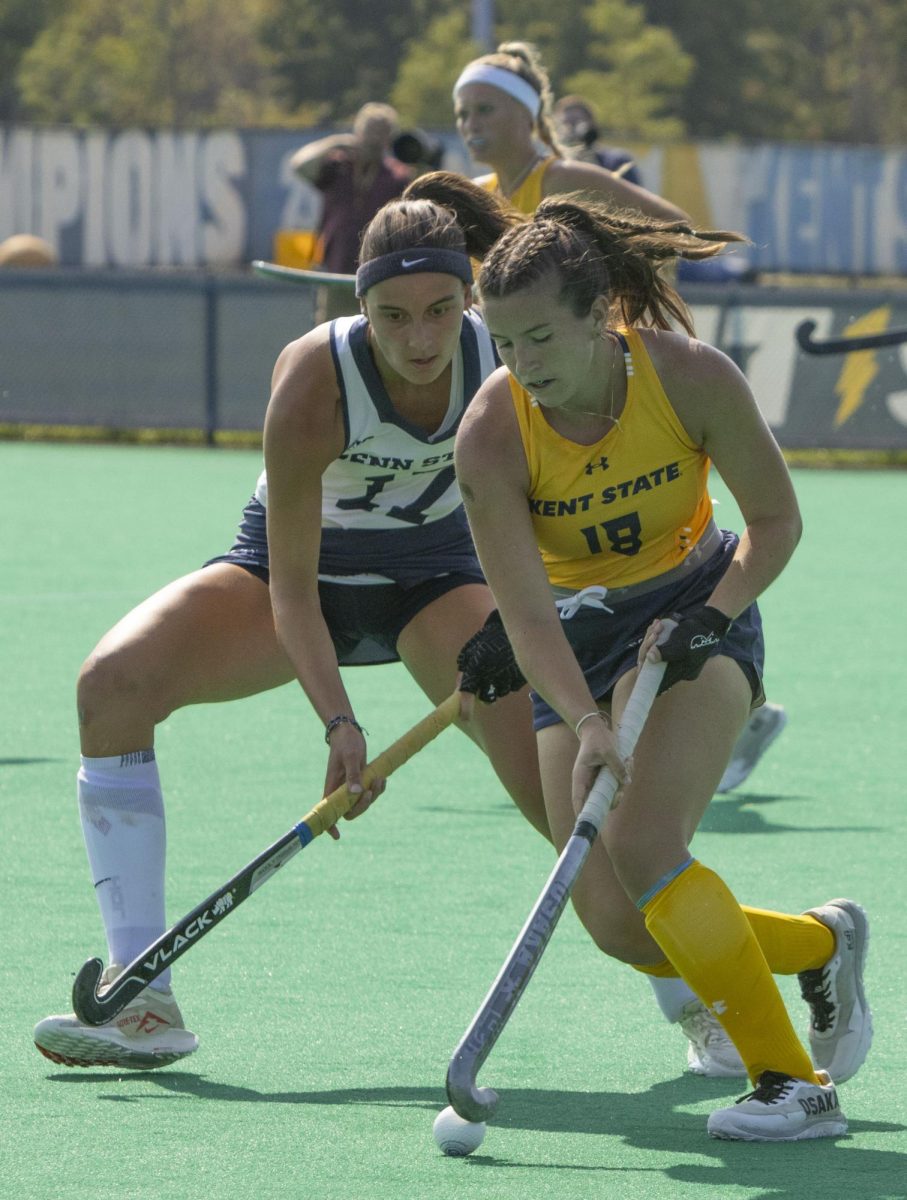 Freshman backer Marissa Skinner (18) fights for possession with Penn State’s junior forward Ella Jennes (17) at the Sept.13, 2024 field hockey game.