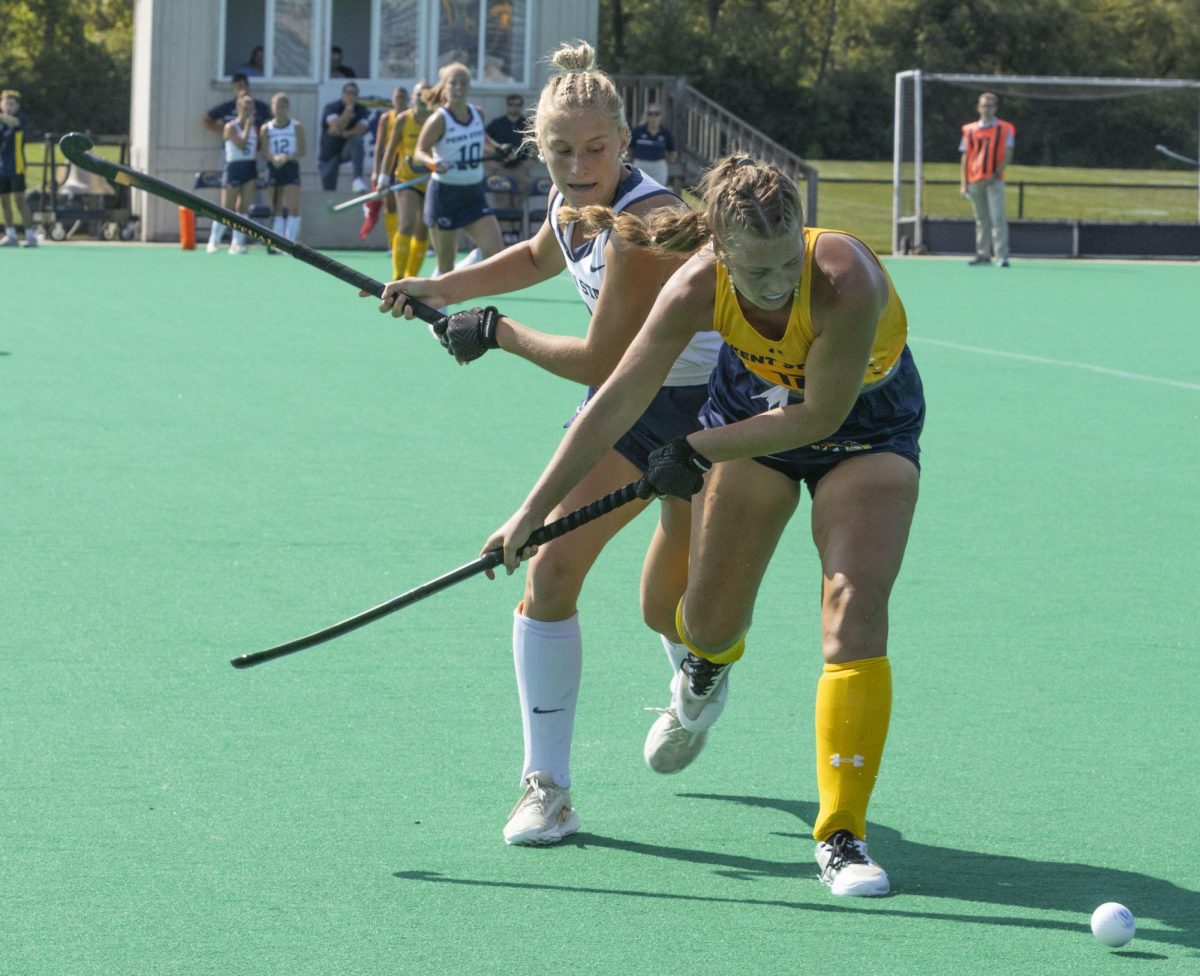 Sophomore midfielder Ashlyn Taylor (12) and Penn State’s redshirt freshman midfielder Madison Britton (11) jockey for possession at the field hockey game Sept. 13, 2024.