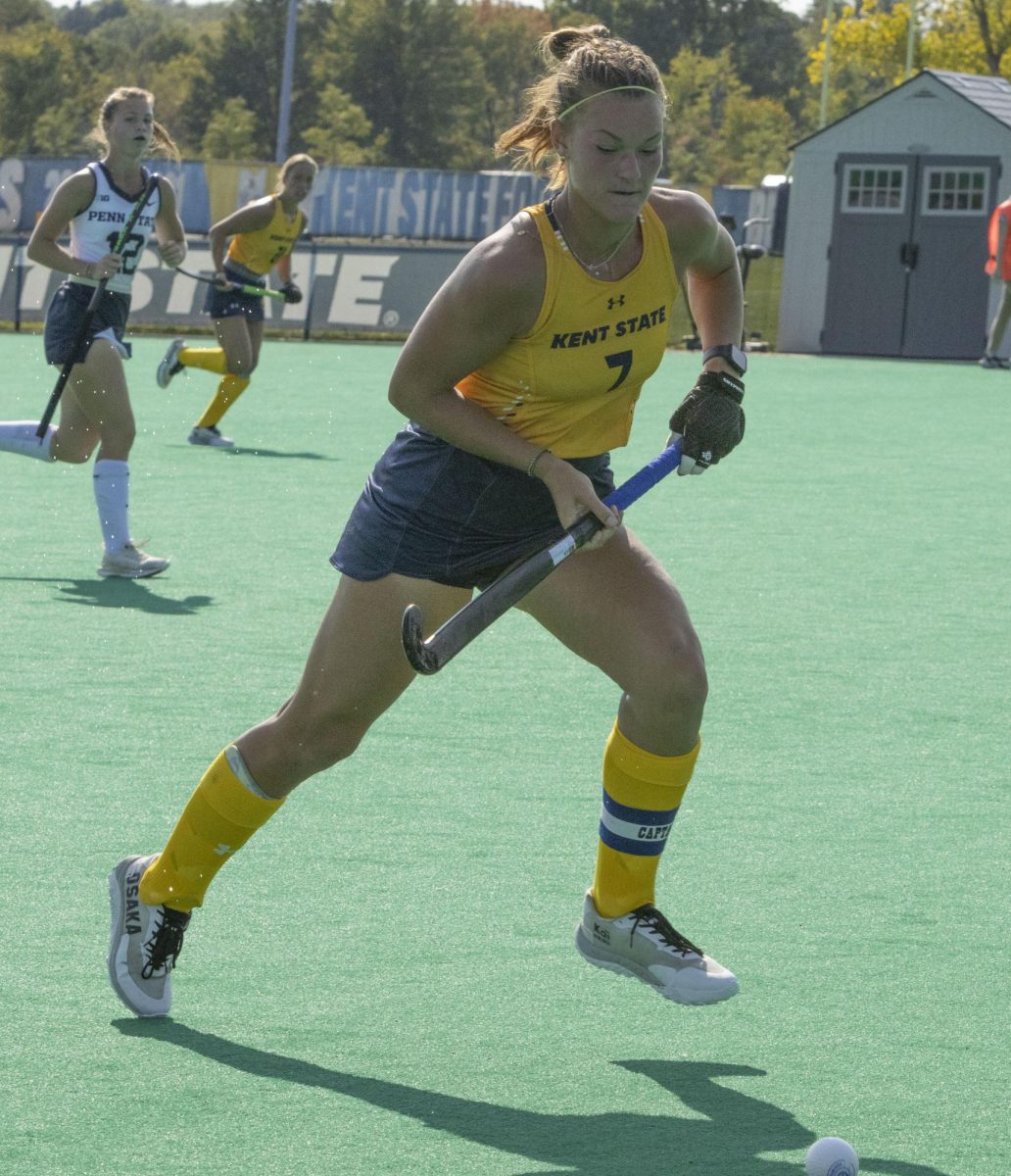 Junior forward Emma Rolston (7) pushes the ball down the pitch at the Sept. 13, 2024 field hockey game against Penn State.