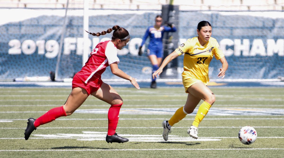 Kent State freshman midfielder Katie Henahan dribbles the ball downfield during the game against Ball State University, Sept. 22, 2024. 