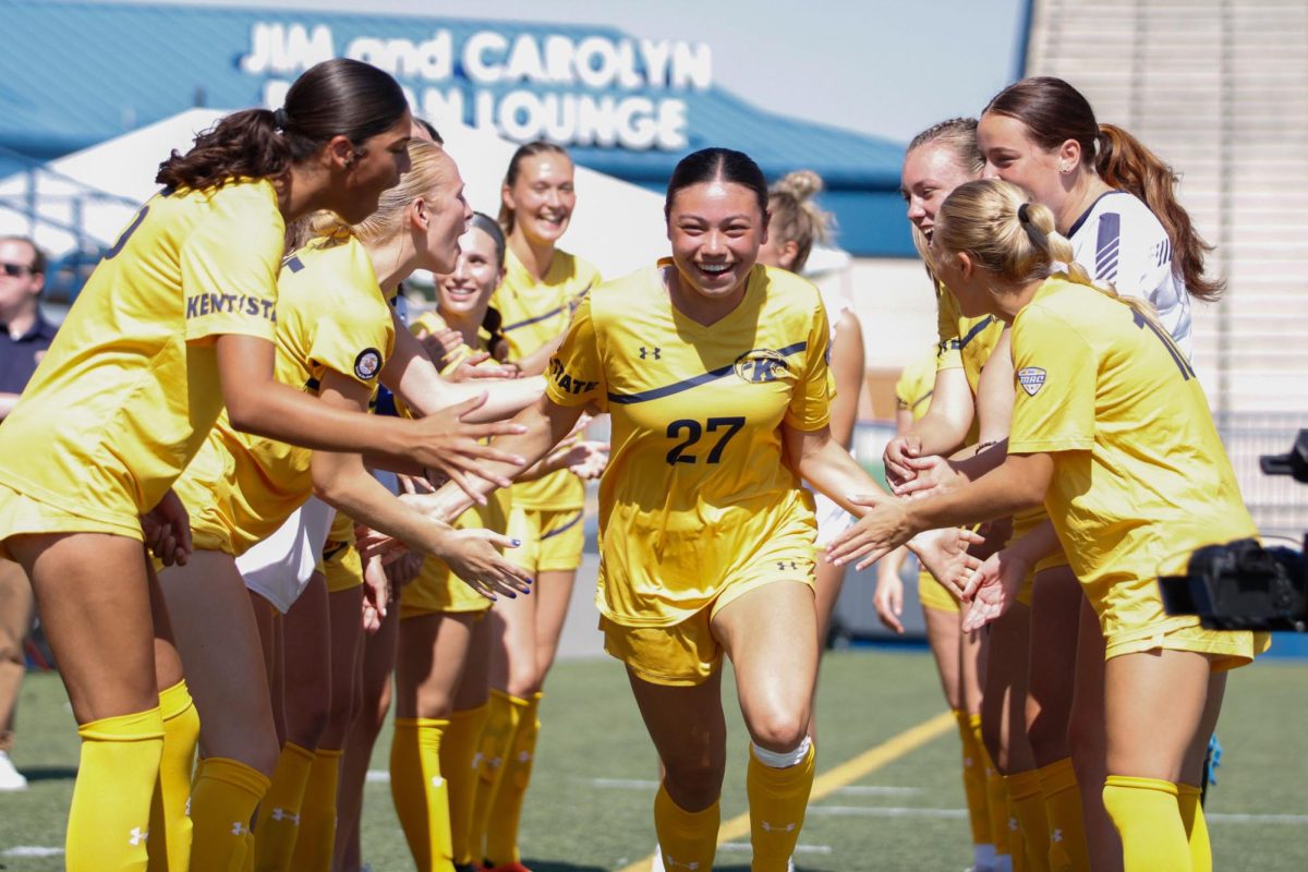 Kent State University, Freshman, Midfielder, Katie Henahan, running through the group during the introduction in their match against Ball State University on September 22,2024.